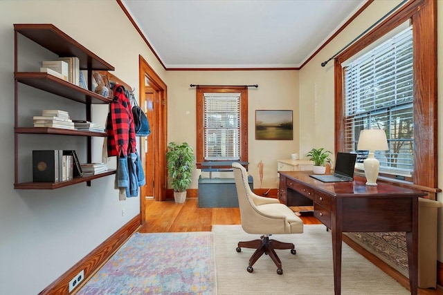 office with crown molding, baseboards, and wood finished floors