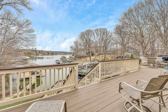 wooden terrace with a water view