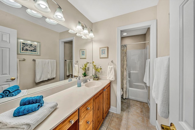 bathroom featuring baseboards, shower / bath combo with shower curtain, vanity, and tile patterned flooring