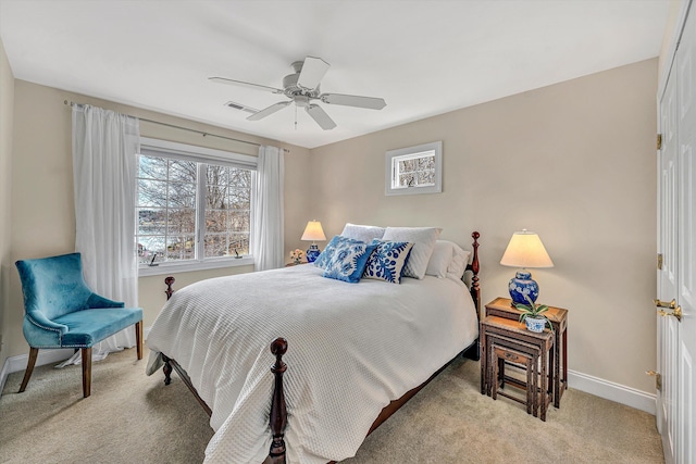 carpeted bedroom featuring visible vents, baseboards, and a ceiling fan