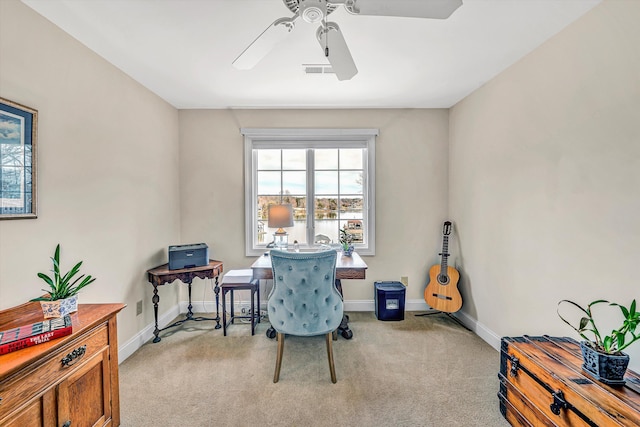 interior space featuring a ceiling fan, visible vents, light colored carpet, and baseboards