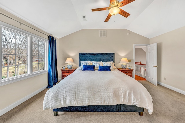 bedroom featuring carpet floors, baseboards, lofted ceiling, and ceiling fan