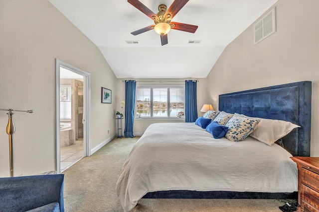 bedroom with vaulted ceiling, carpet, a ceiling fan, baseboards, and connected bathroom