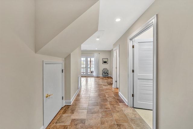 hallway with recessed lighting, french doors, and baseboards