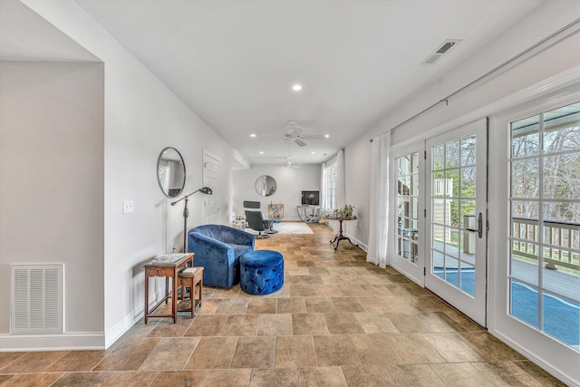 living area featuring visible vents, recessed lighting, baseboards, and ceiling fan