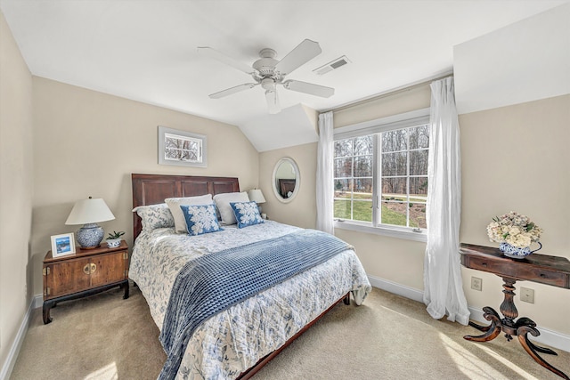 bedroom featuring carpet, baseboards, a ceiling fan, and vaulted ceiling