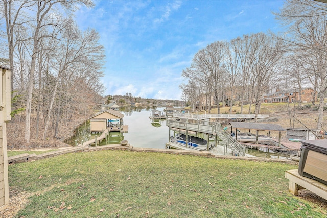 view of dock with boat lift, a water view, and a lawn