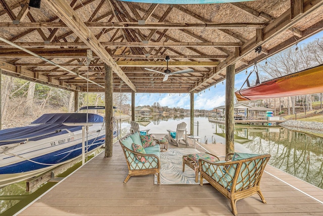 dock area with boat lift and a water view