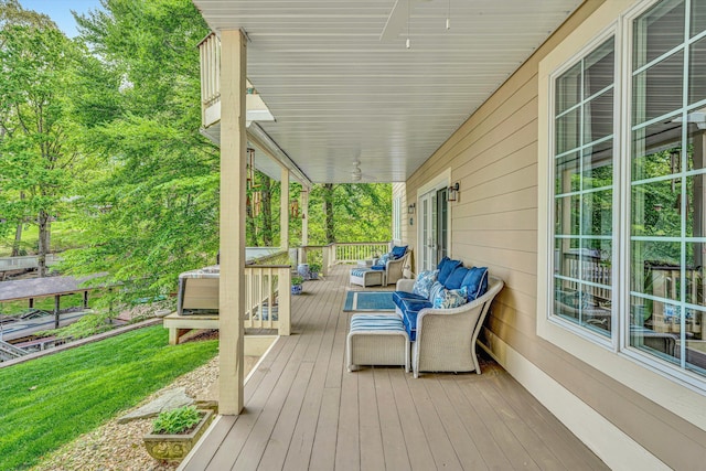 wooden deck with an outdoor hangout area