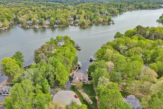 aerial view of a nearby body of water and a heavily wooded area