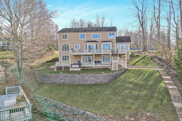 back of property with a yard, a patio, a deck, and stairway