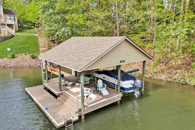 dock area featuring boat lift and a water view