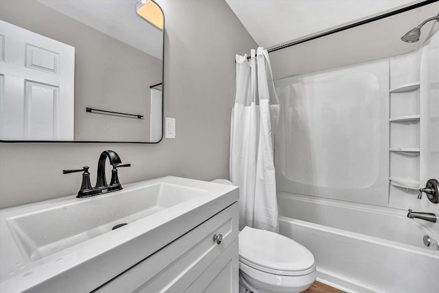 full bathroom featuring toilet, vanity, and shower / bath combo