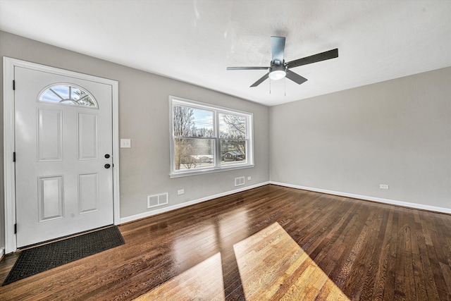 foyer entrance with ceiling fan, wood finished floors, visible vents, and baseboards