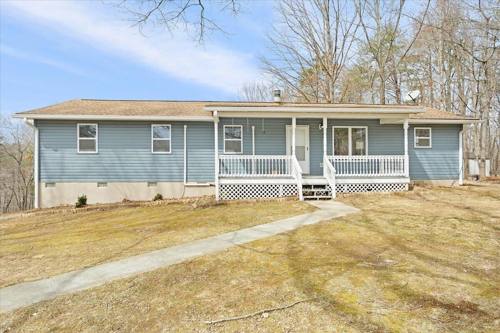 single story home featuring a front lawn, covered porch, and crawl space