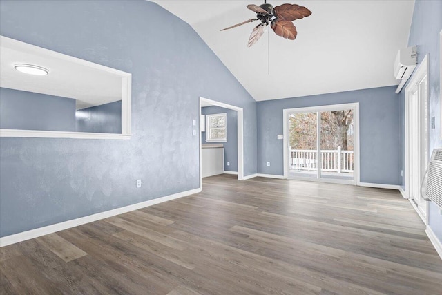 unfurnished living room with ceiling fan, plenty of natural light, wood finished floors, and a wall mounted AC