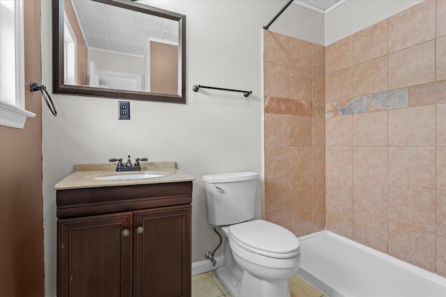 bathroom featuring tile patterned flooring, tiled shower, toilet, and vanity