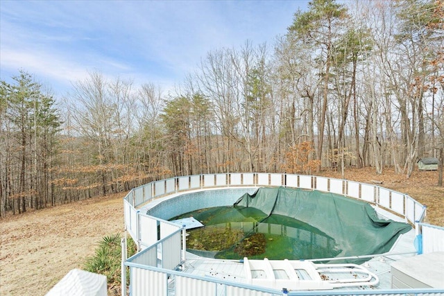 view of swimming pool with a covered pool