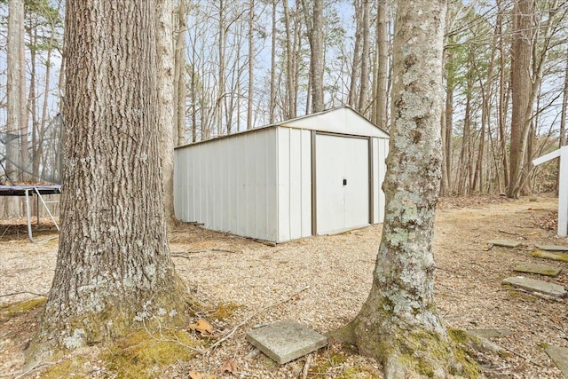 view of shed with a trampoline