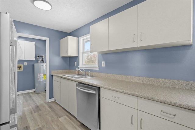 kitchen featuring dishwasher, light countertops, water heater, white cabinetry, and a sink