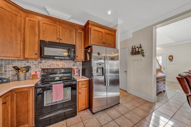 kitchen with backsplash, black appliances, light countertops, and ornamental molding