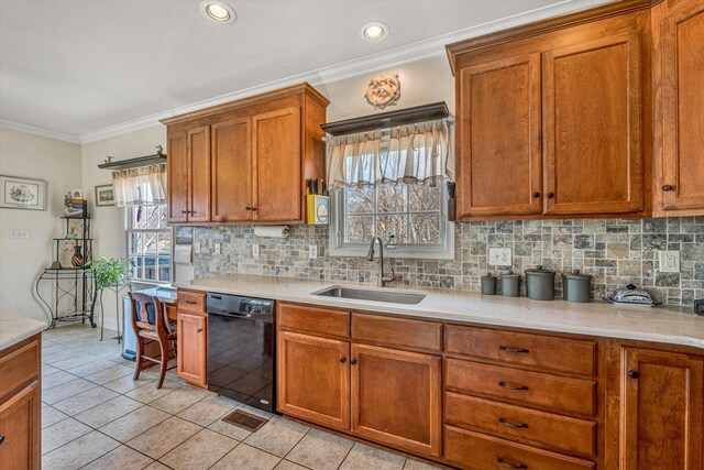 kitchen featuring ornamental molding, a sink, brown cabinetry, light countertops, and dishwasher