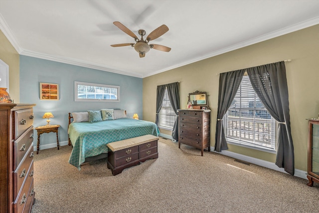 carpeted bedroom with ceiling fan, baseboards, and ornamental molding