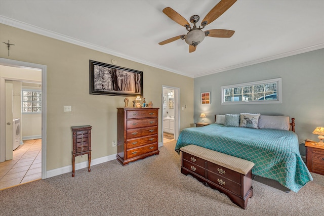 carpeted bedroom featuring connected bathroom, a ceiling fan, baseboards, and ornamental molding