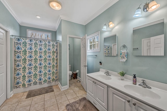 full bath with tile patterned floors, toilet, crown molding, and a sink