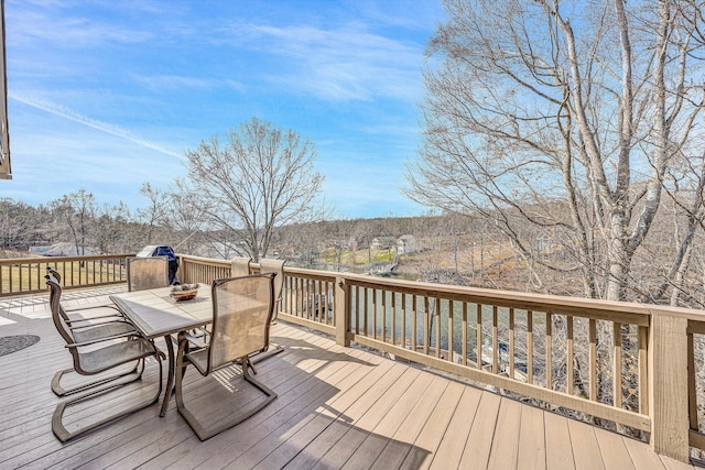 wooden terrace featuring outdoor dining area