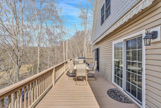 wooden deck with outdoor dining area