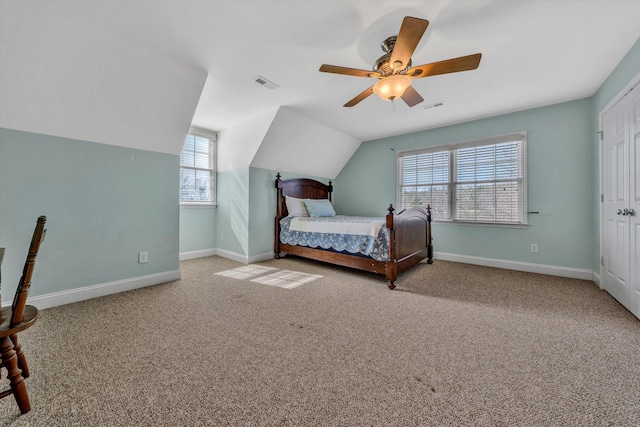 bedroom with visible vents, baseboards, carpet, and vaulted ceiling