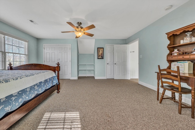 carpeted bedroom featuring a ceiling fan, baseboards, visible vents, and a closet