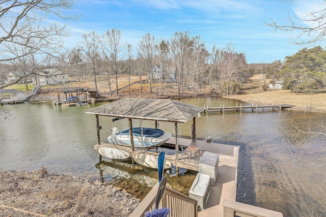 dock area with a water view and boat lift