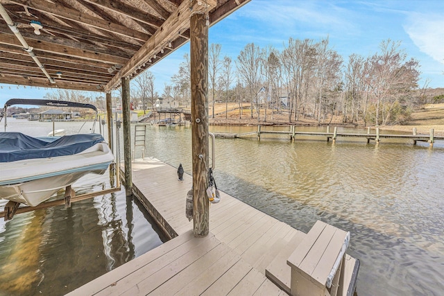 view of dock featuring a water view and boat lift