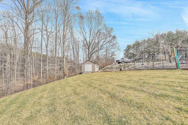 view of yard featuring an outbuilding and a shed