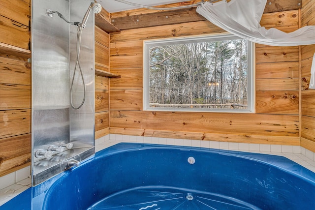 full bath with wooden walls, walk in shower, and a washtub