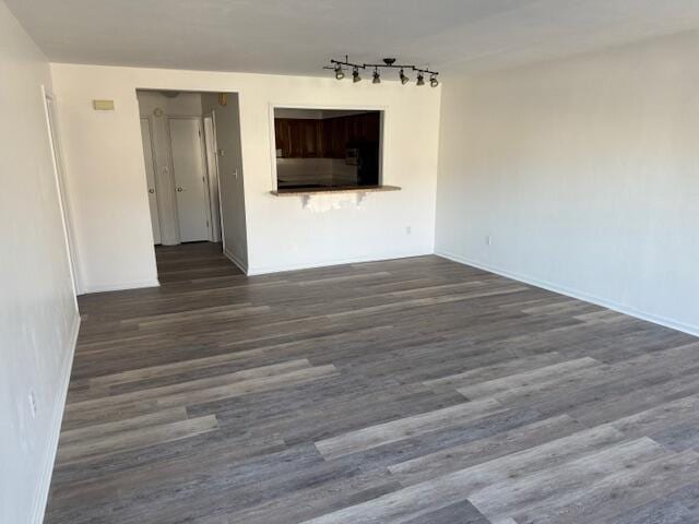 spare room with dark wood finished floors