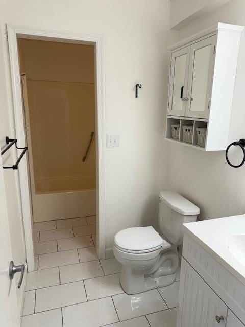 bathroom with vanity, shower / tub combination, and toilet