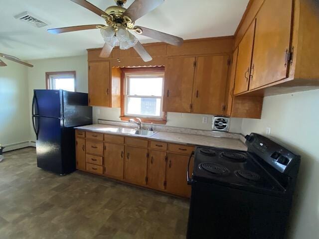 kitchen featuring a healthy amount of sunlight, visible vents, ceiling fan, black appliances, and light countertops