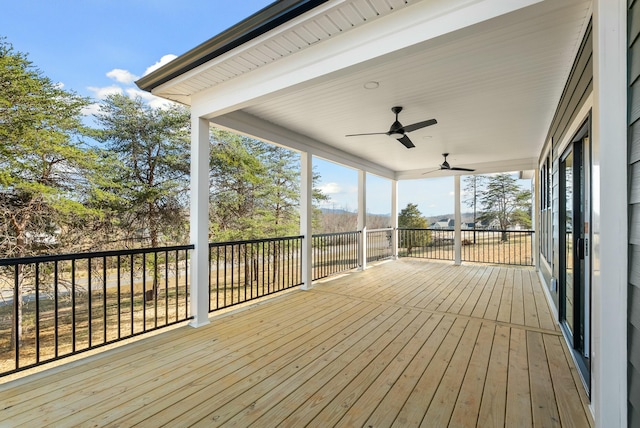 wooden terrace featuring ceiling fan