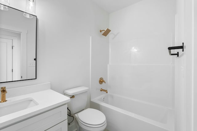 bathroom featuring vanity, toilet, and shower / bathtub combination