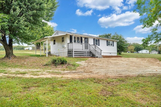 view of front of house featuring a front lawn, covered porch, and crawl space