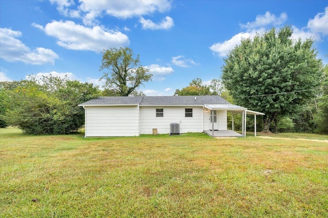 39 Daisy Hill Ln, Rocky Mount, VA 24151 - back of property with central AC unit, a lawn, and a patio