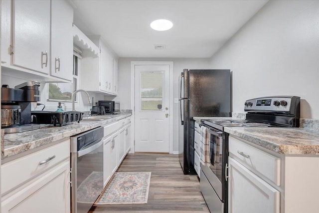39 Daisy Hill Ln, Rocky Mount, VA 24151 - kitchen featuring light countertops, white cabinets, appliances with stainless steel finishes, and a sink