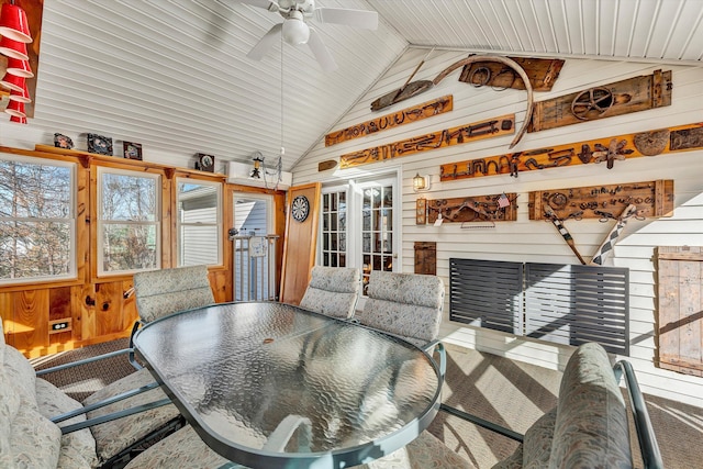 sunroom / solarium with lofted ceiling, french doors, and ceiling fan