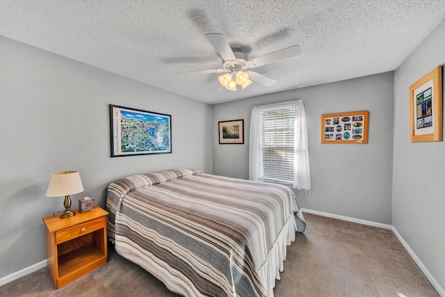 bedroom with a textured ceiling, baseboards, and carpet