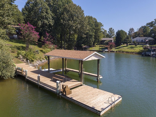 dock area with a water view and boat lift