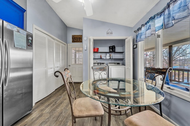 dining area with lofted ceiling, wood finished floors, a ceiling fan, and washing machine and clothes dryer