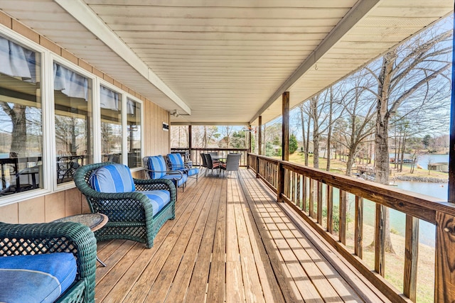 wooden deck with a water view